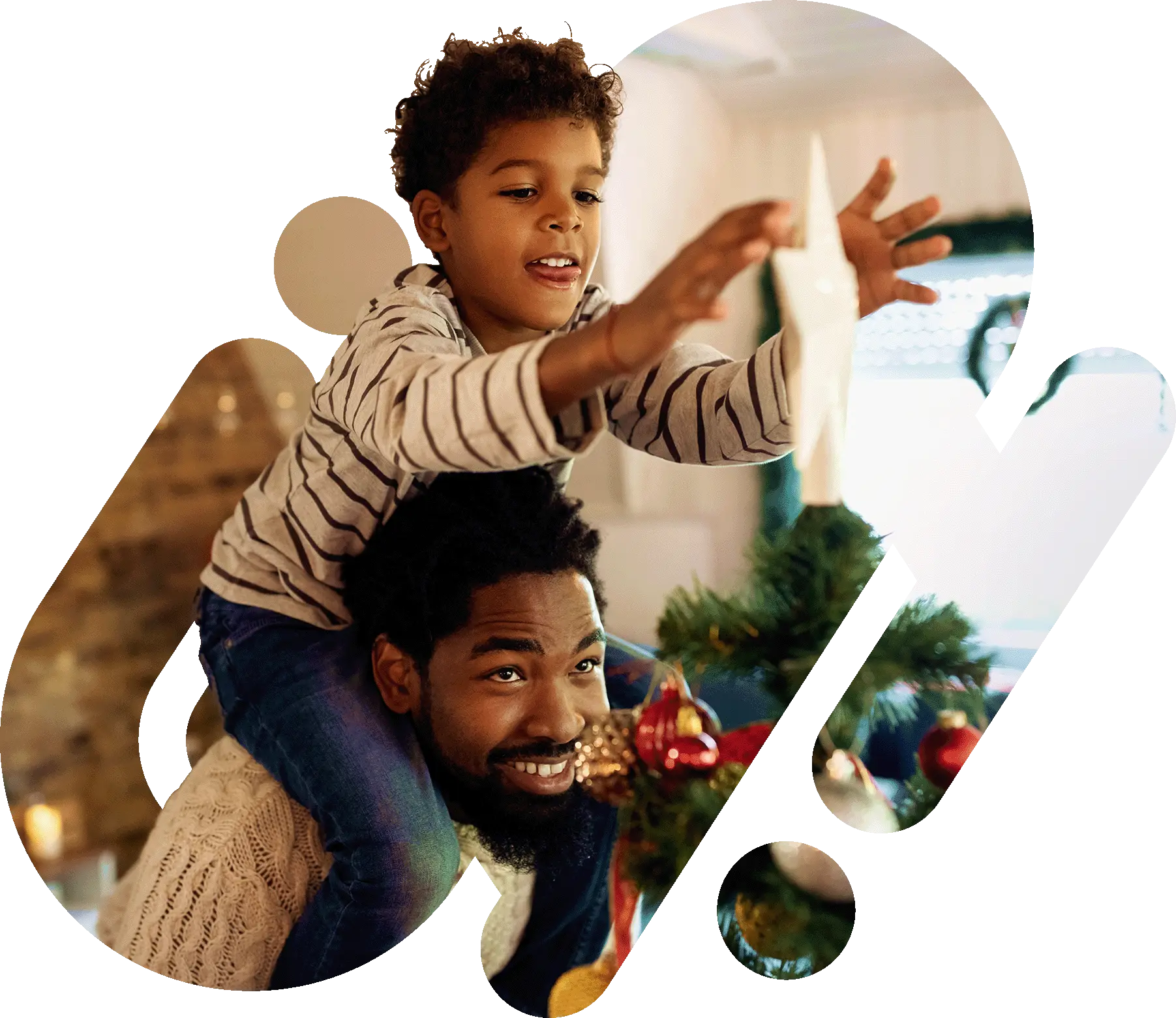 Father and son placing Christmas star