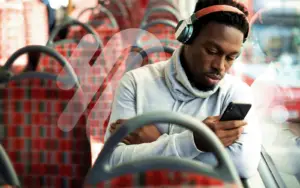 Man on Bus looking at phone