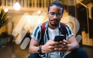 Man using phone sat in Living Room